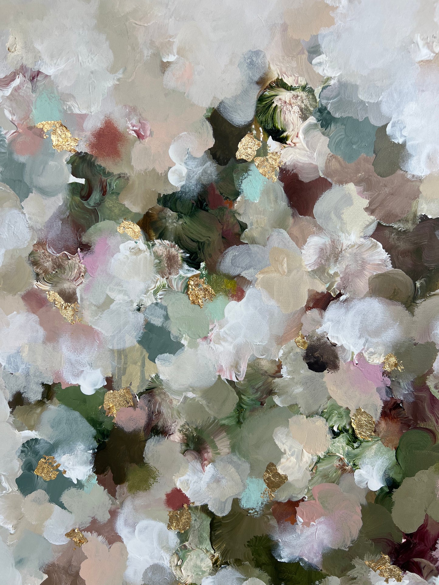 Nebula Moillis AurumAn abstract floral painting featuring textured, painterly blossoms in soft shades of white, pink, green, and muted purple, accented with gold leaf details, framed in a light wood border.
